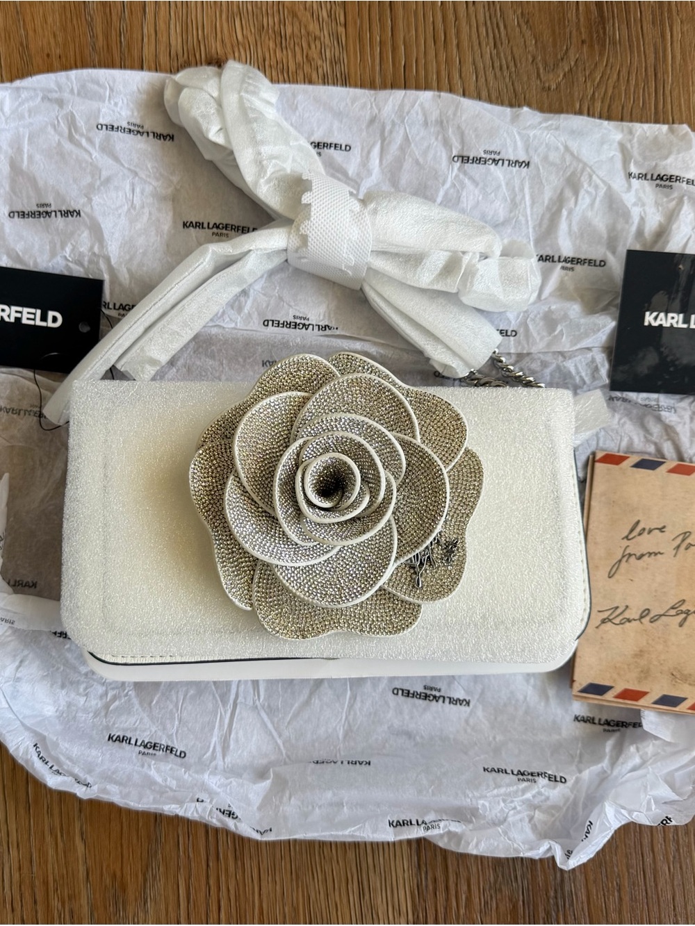 Karl Lagerfeld White Clutch with Gold-Tone Floral Applique